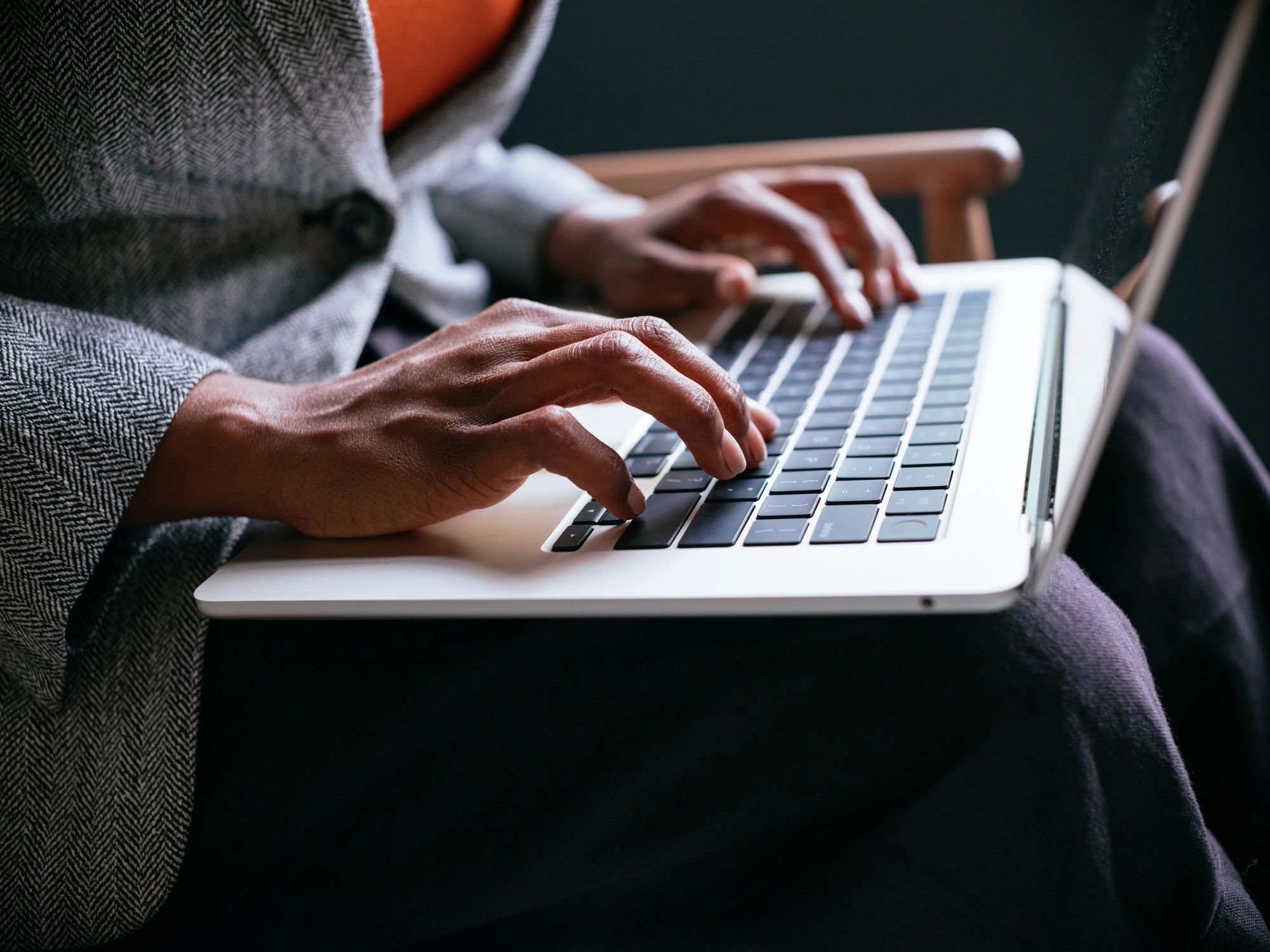 Person searching online on a laptop