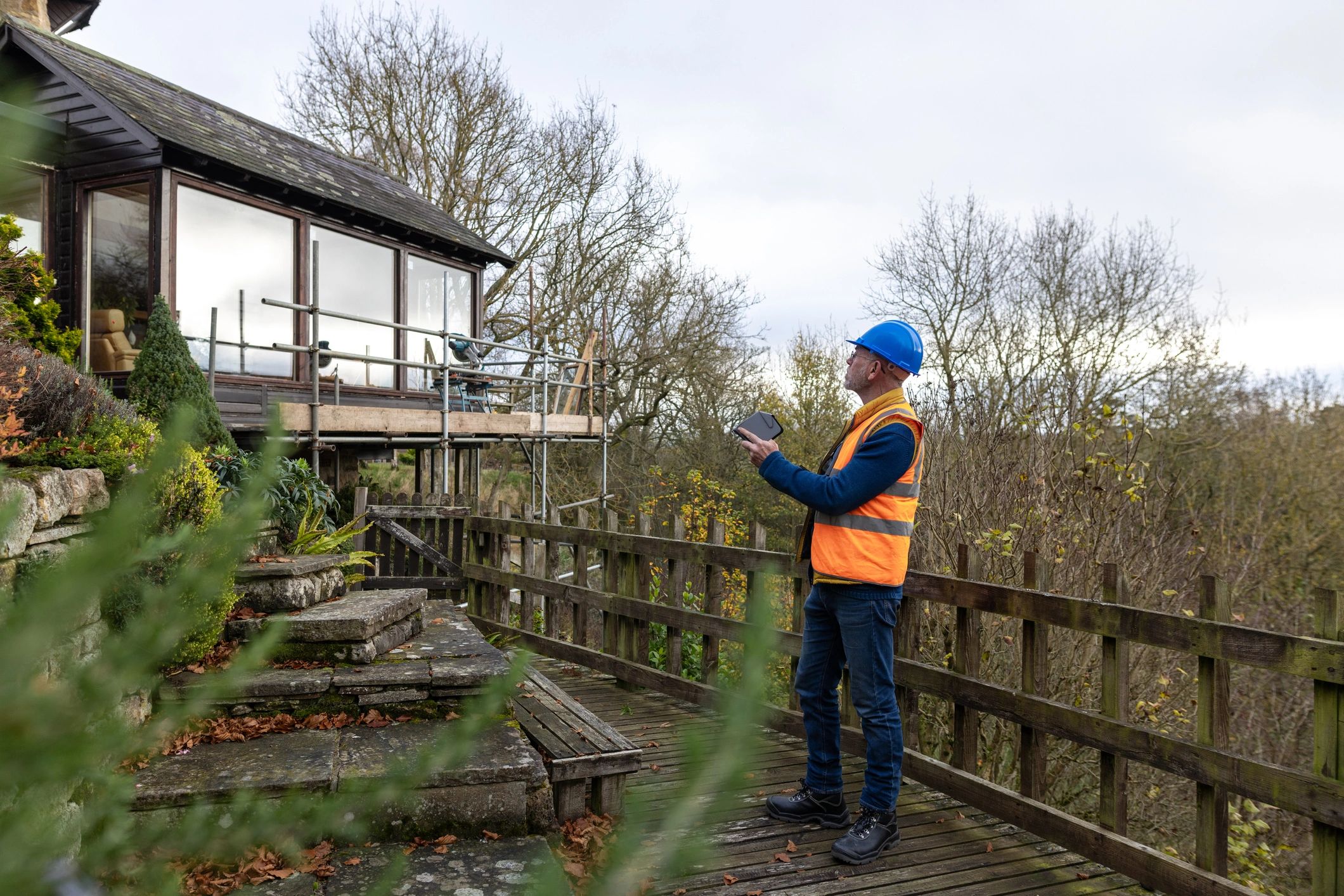 Field technician working outdoors with digital tools